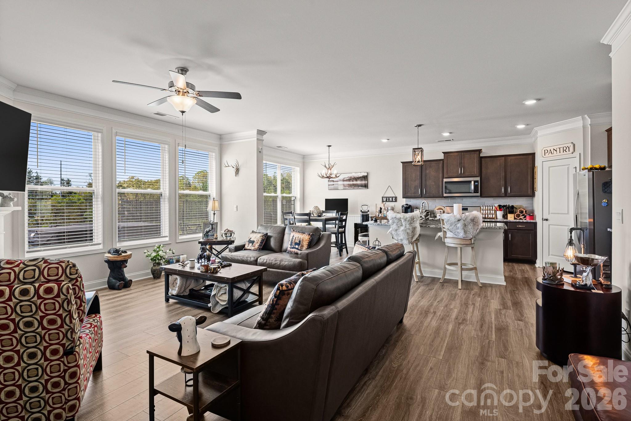 199 Fox Cove Road Hendersonville, NC 28792 - Photo 11 of 48 a living room with furniture kitchen area and a large window