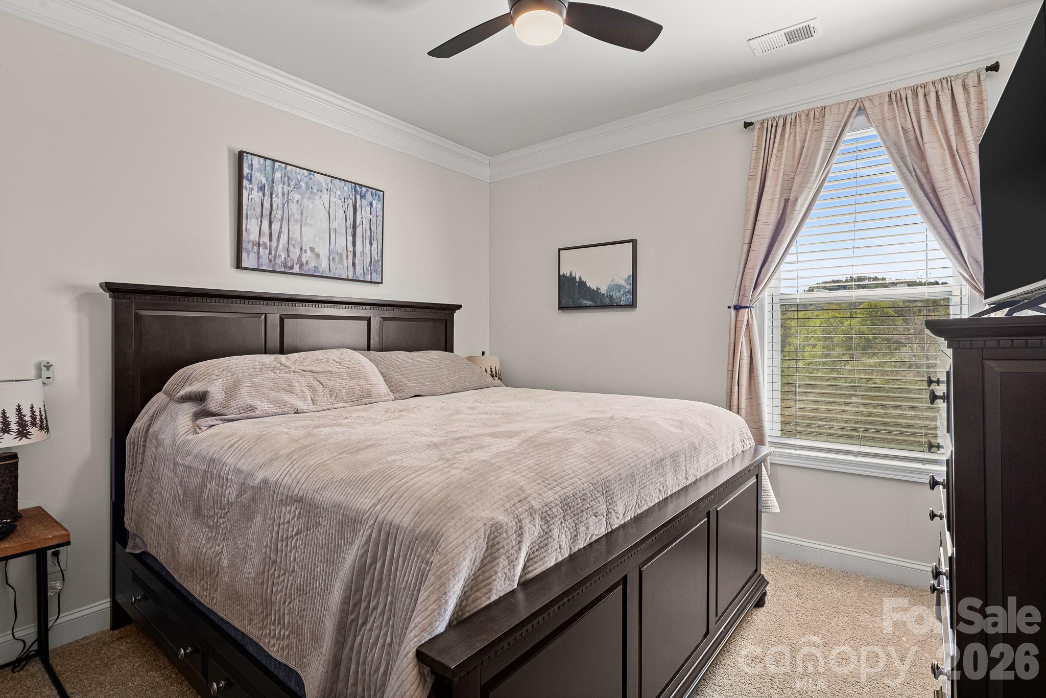 199 Fox Cove Road Hendersonville, NC 28792 - Photo 16 of 48 a bedroom with a bed and a window