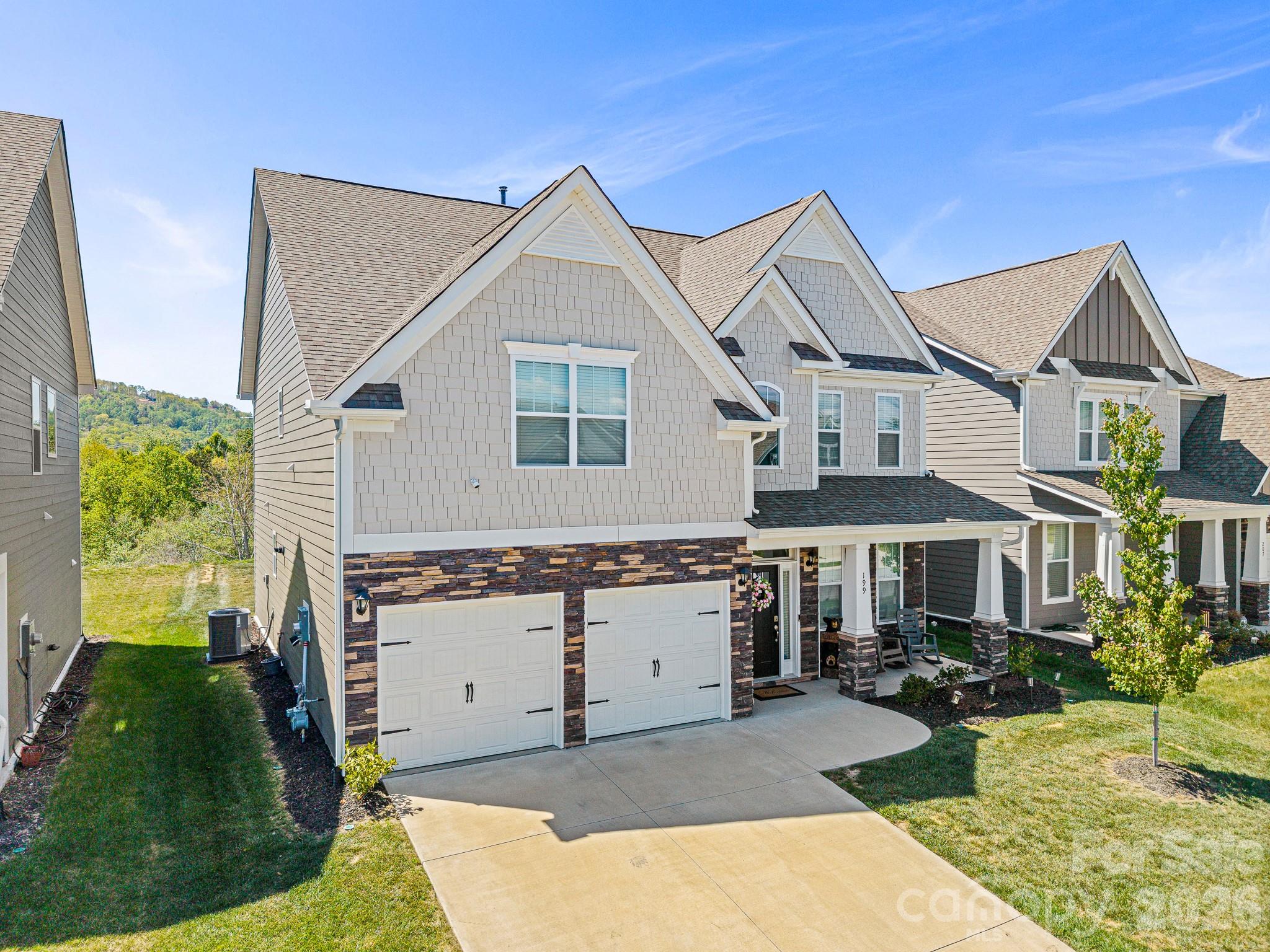 199 Fox Cove Road Hendersonville, NC 28792 - Photo 2 of 48 a view of house with yard and green space