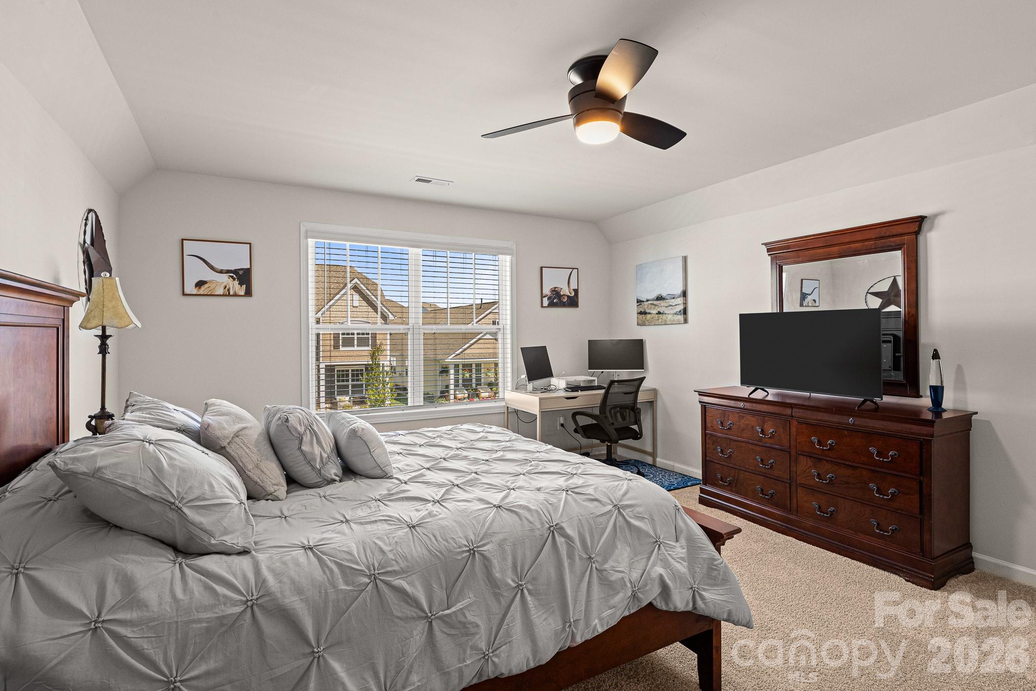 199 Fox Cove Road Hendersonville, NC 28792 - Photo 21 of 48 a bedroom with a bed and a flat screen television