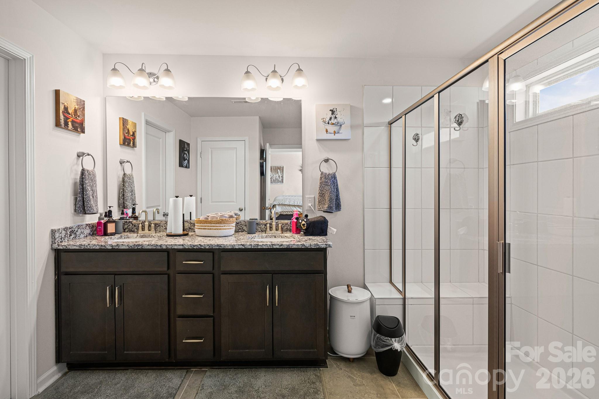 199 Fox Cove Road Hendersonville, NC 28792 - Photo 25 of 48 a bathroom with a double vanity sink mirror and toilet