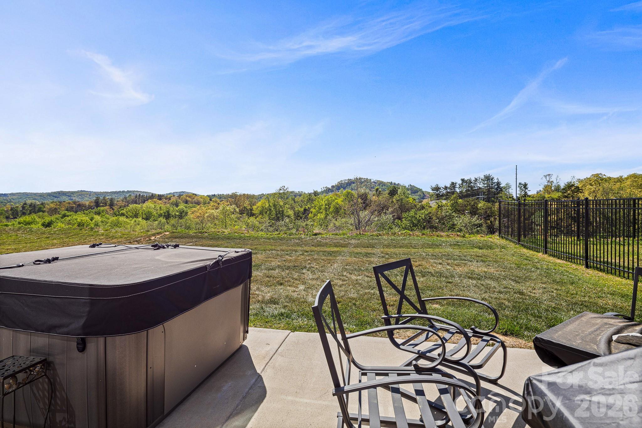 199 Fox Cove Road Hendersonville, NC 28792 - Photo 34 of 48 a view of a chairs and table on the terrace