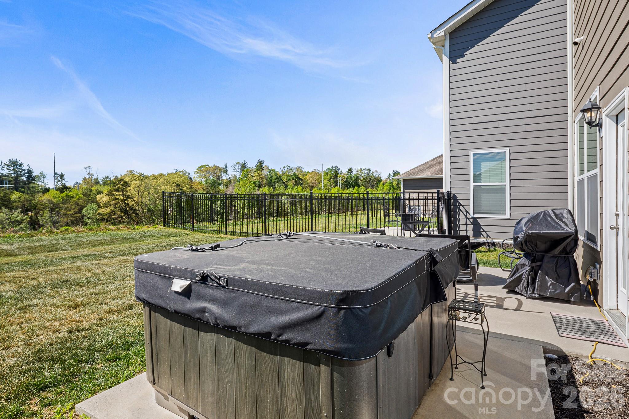 199 Fox Cove Road Hendersonville, NC 28792 - Photo 35 of 48 a terrace with outdoor seating and trees