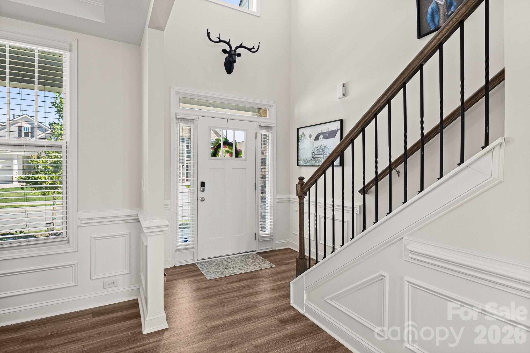 199 Fox Cove Road Hendersonville, NC 28792 - Photo 4 of 48 a view of entryway with wooden floor and stairs