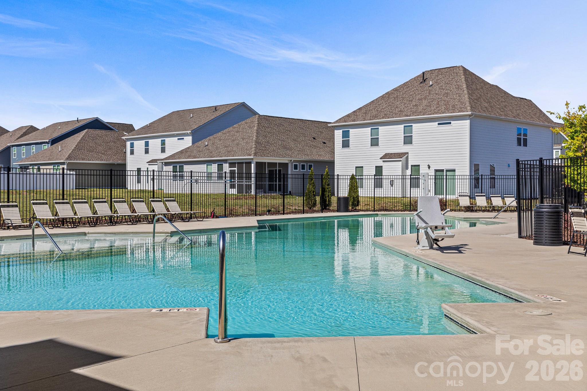 199 Fox Cove Road Hendersonville, NC 28792 - Photo 44 of 48 a swimming pool view with a seating space and a garden view