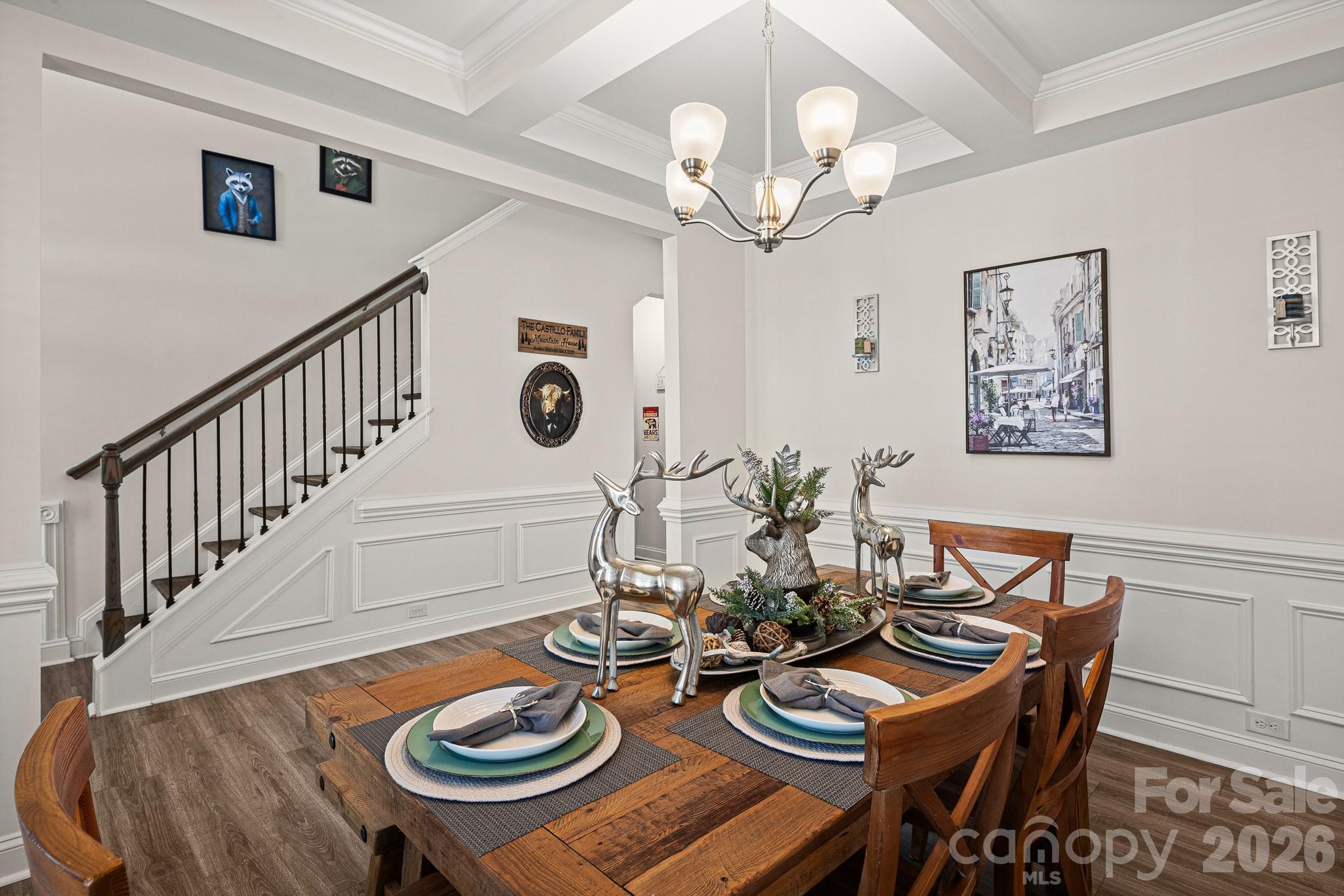 199 Fox Cove Road Hendersonville, NC 28792 - Photo 7 of 48 a view of a dining room with furniture a chandelier and wooden floor