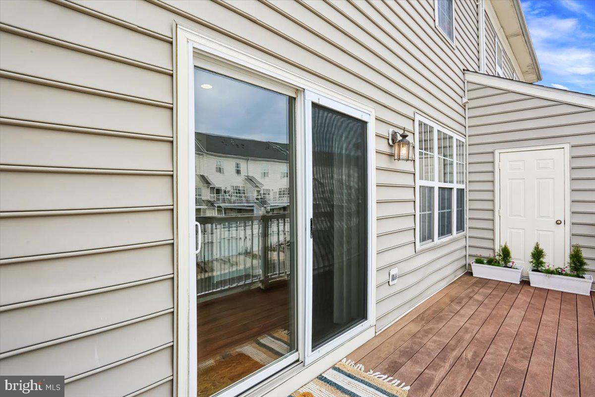 723 Main Street, Unit 723B Gaithersburg, MD 20878 - Photo 11 of 71 a view of a house with a balcony
