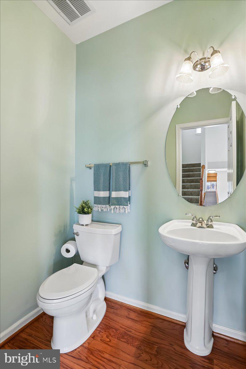 723 Main Street, Unit 723B Gaithersburg, MD 20878 - Photo 16 of 70 A powder room & coat closet round out main level