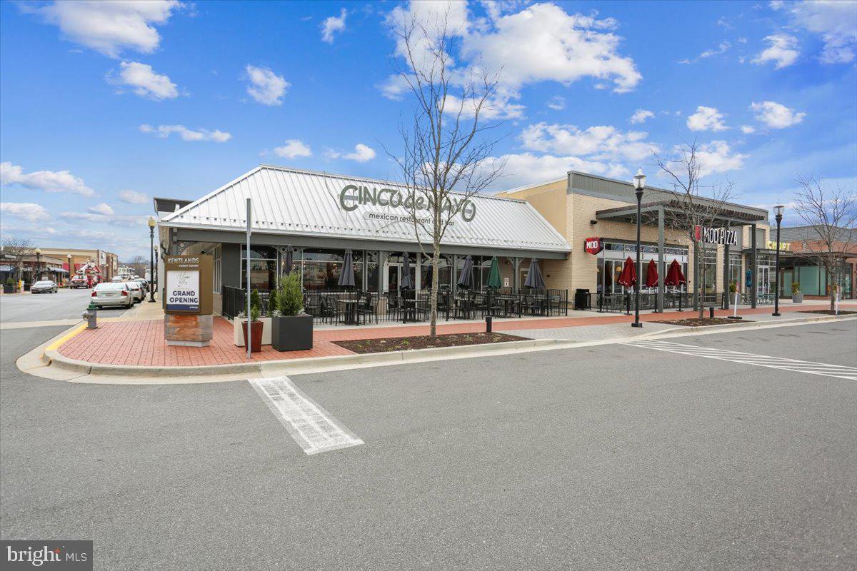 723 Main Street, Unit 723B Gaithersburg, MD 20878 - Photo 59 of 71 a view of a building with a umbrellas