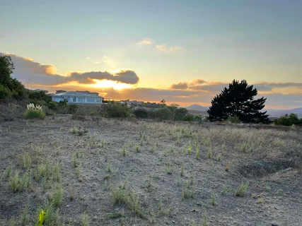 a view of ocean and mountains