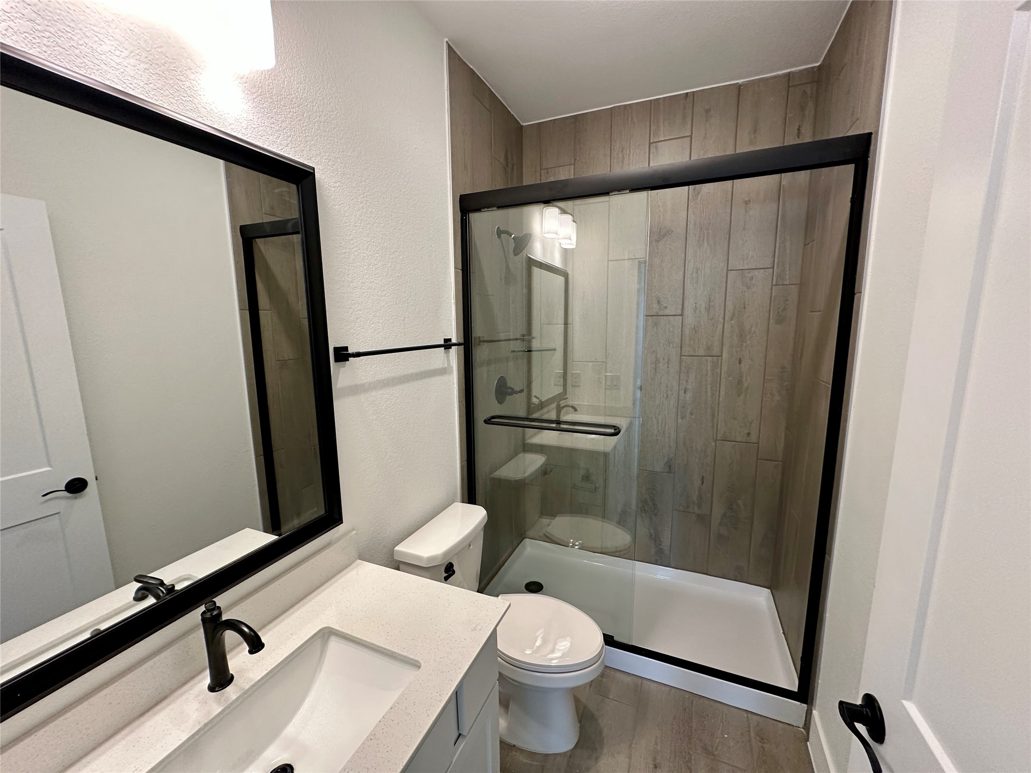 485 Lone Ranger Drive Montgomery, TX 77316 - Photo 18 of 32 a bathroom with a toilet and a shower