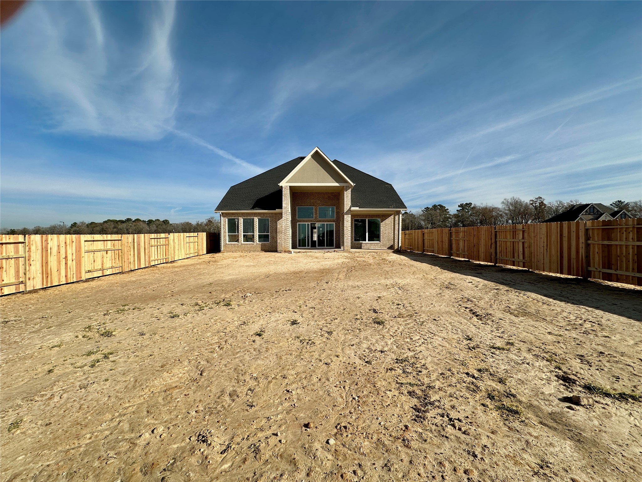 485 Lone Ranger Drive Montgomery, TX 77316 - Photo 25 of 32 a view of a house with a yard covered in snow
