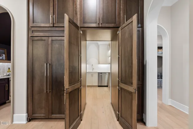 a bathroom with a sink vanity and a toilet