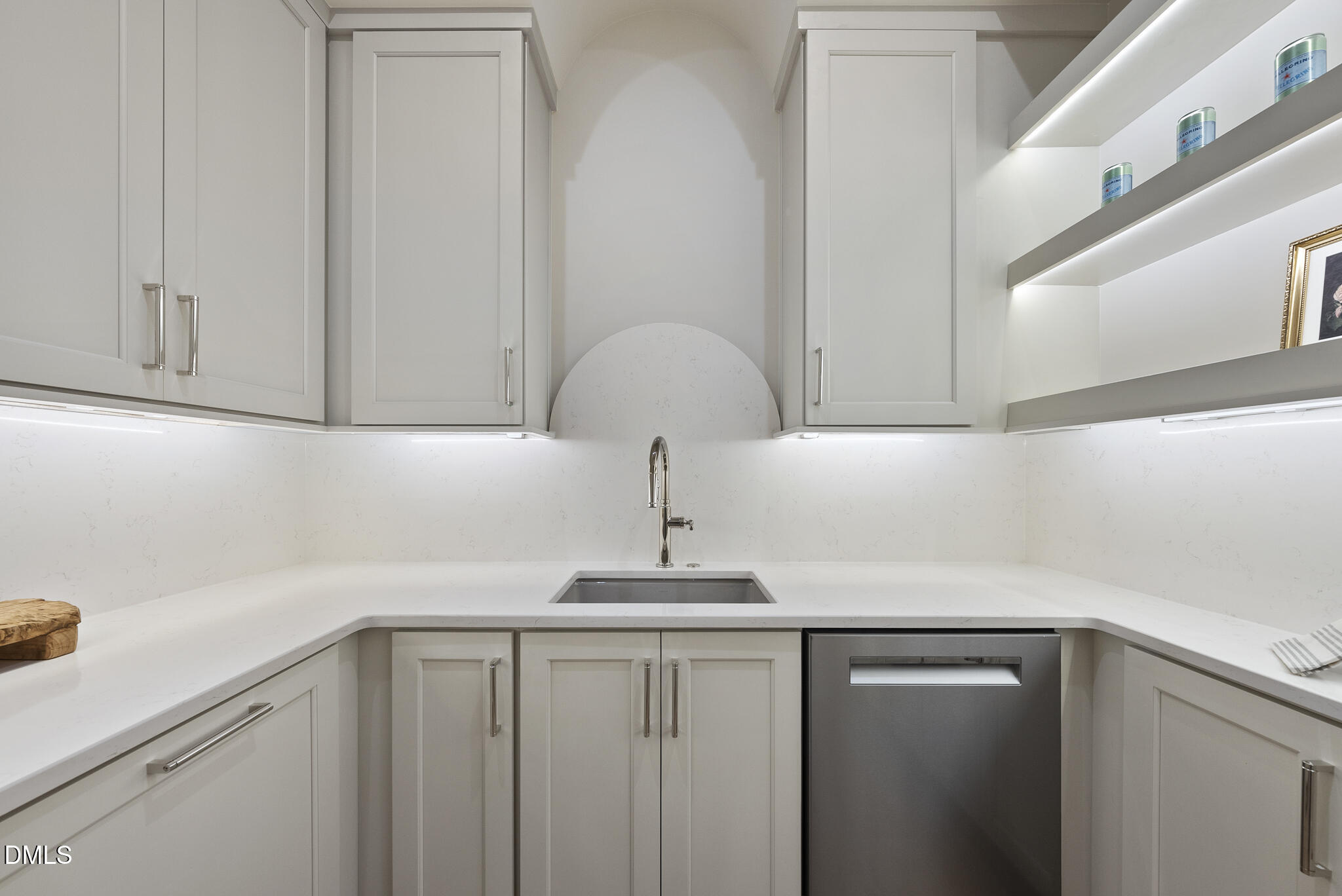 7000 North Ridge Drive Raleigh, NC 27615 - Photo 14 of 79 a sink with white cabinets