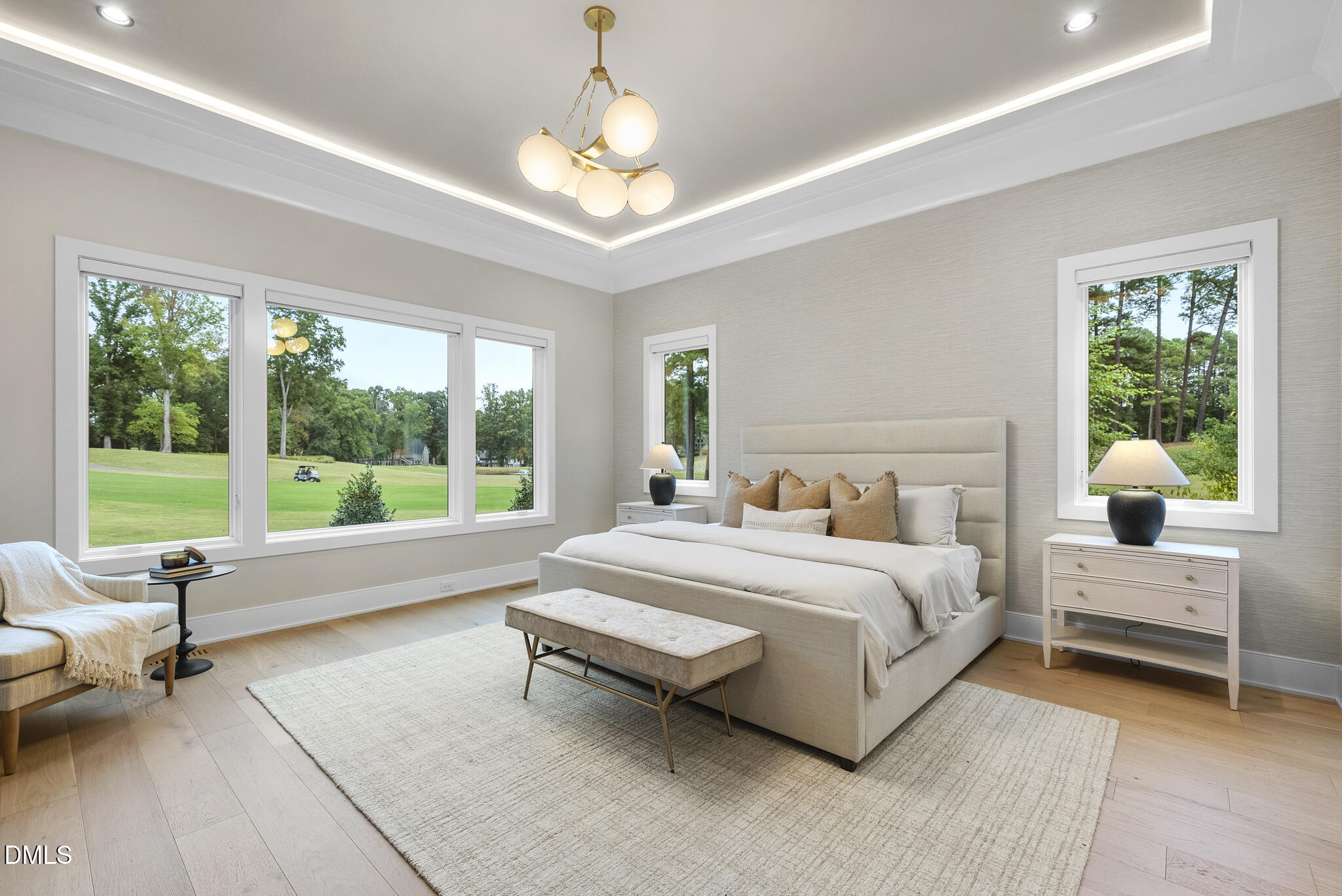 7000 North Ridge Drive Raleigh, NC 27615 - Photo 22 of 79 a spacious bedroom with a bed and a large window