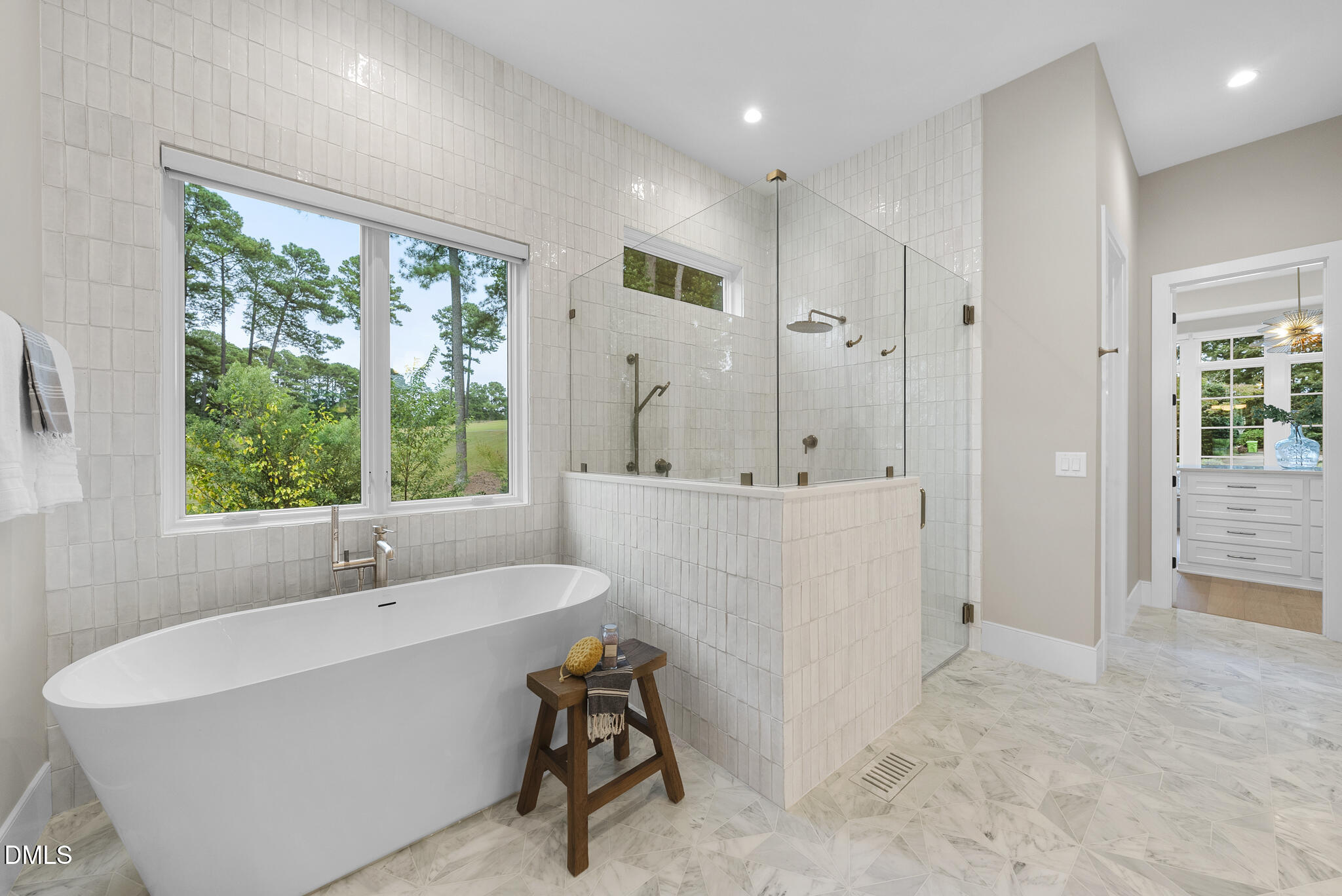 7000 North Ridge Drive Raleigh, NC 27615 - Photo 26 of 79 a bathroom with a tub sink and mirror