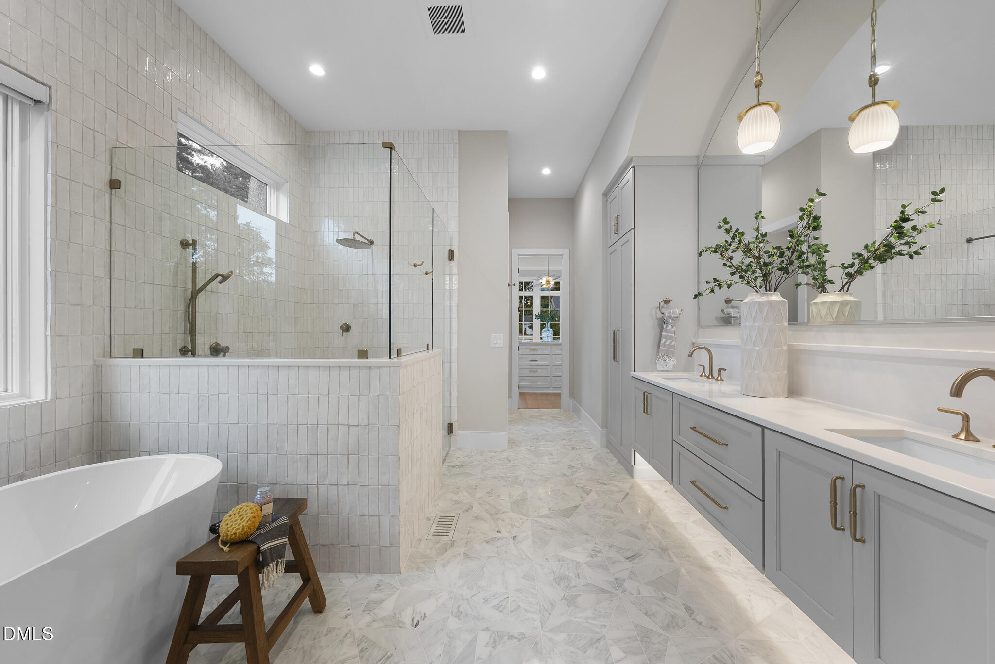 7000 North Ridge Drive Raleigh, NC 27615 - Photo 28 of 79 a bathroom with a tub sink and mirror