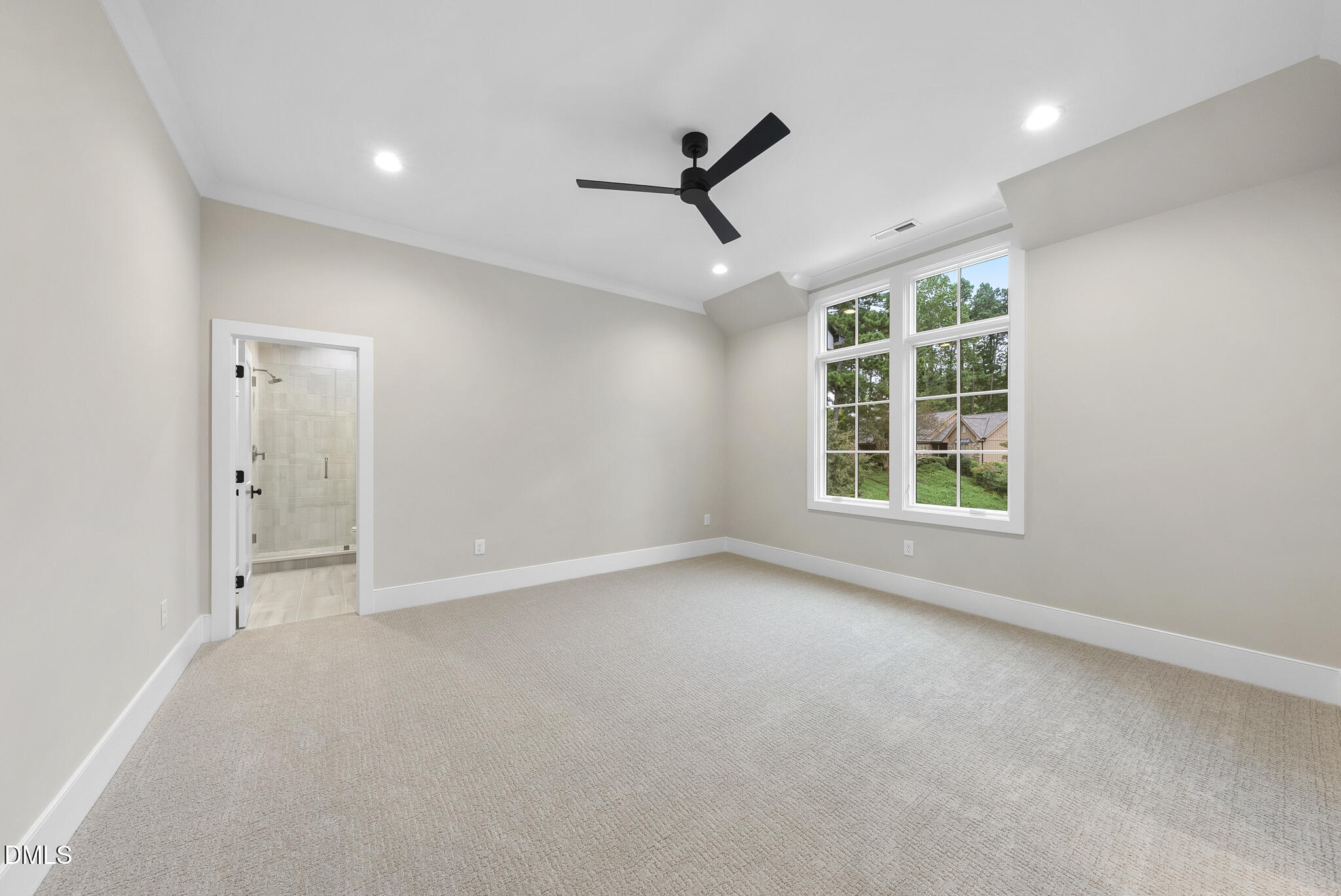 7000 North Ridge Drive Raleigh, NC 27615 - Photo 35 of 79 an empty room with windows and ceiling fan