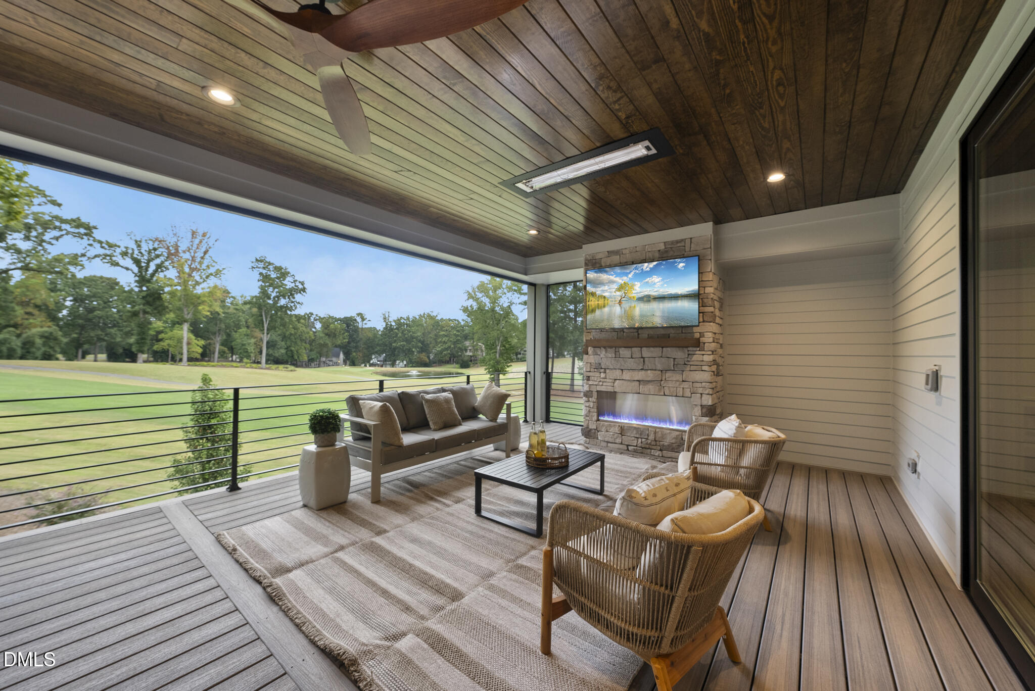 7000 North Ridge Drive Raleigh, NC 27615 - Photo 44 of 79 a view of a patio with couches chairs potted plants and wooden floor