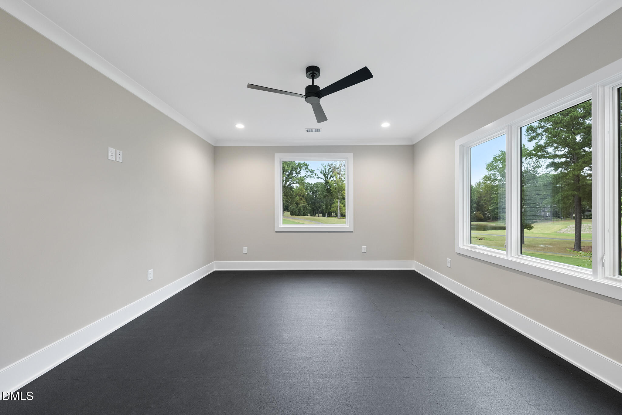 7000 North Ridge Drive Raleigh, NC 27615 - Photo 57 of 79 a view of empty room with wooden floor and fan