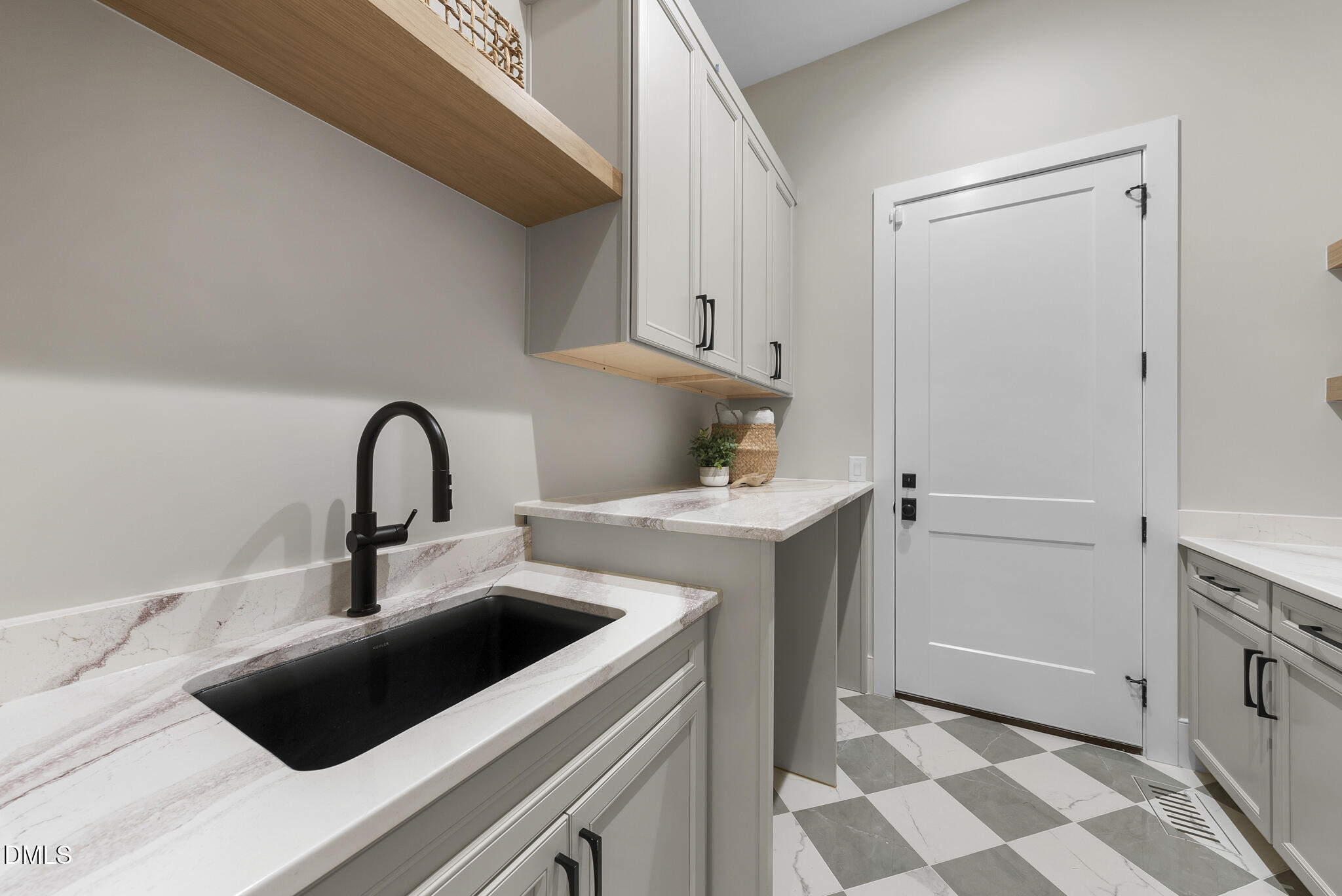 7000 North Ridge Drive Raleigh, NC 27615 - Photo 63 of 79 a kitchen with a sink and a stove top oven