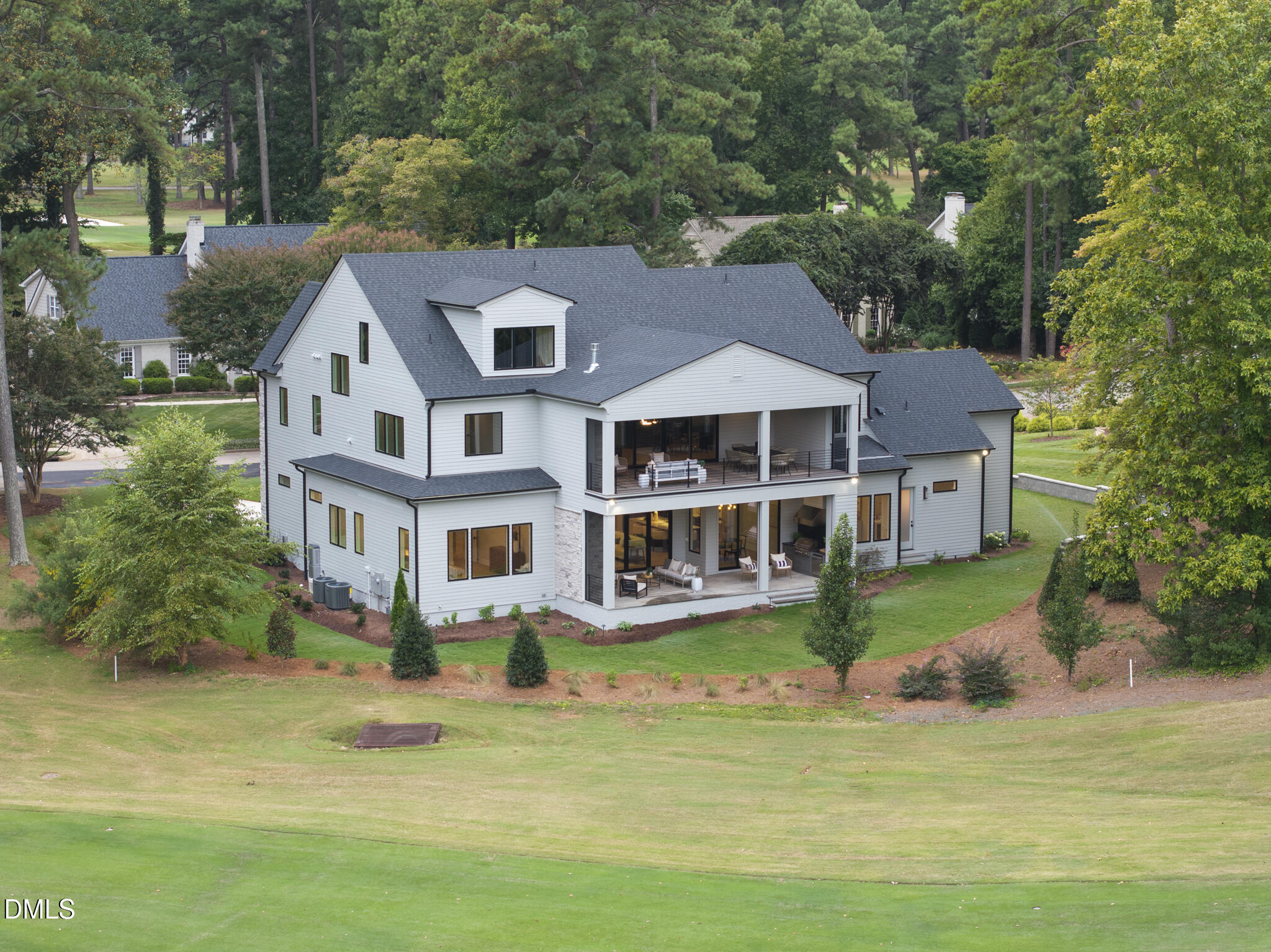 7000 North Ridge Drive Raleigh, NC 27615 - Photo 70 of 79 a front view of a house with a garden and swimming pool