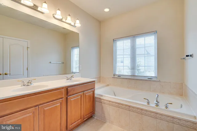 an empty room with chandelier fan