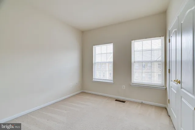a white bath tub sitting next to a white toilet and a shower