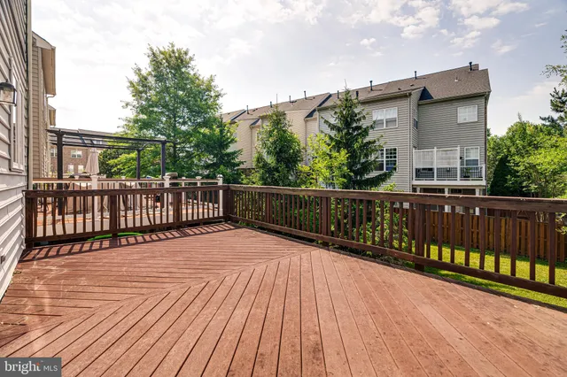 a view of a swimming pool with a sitting area and garden