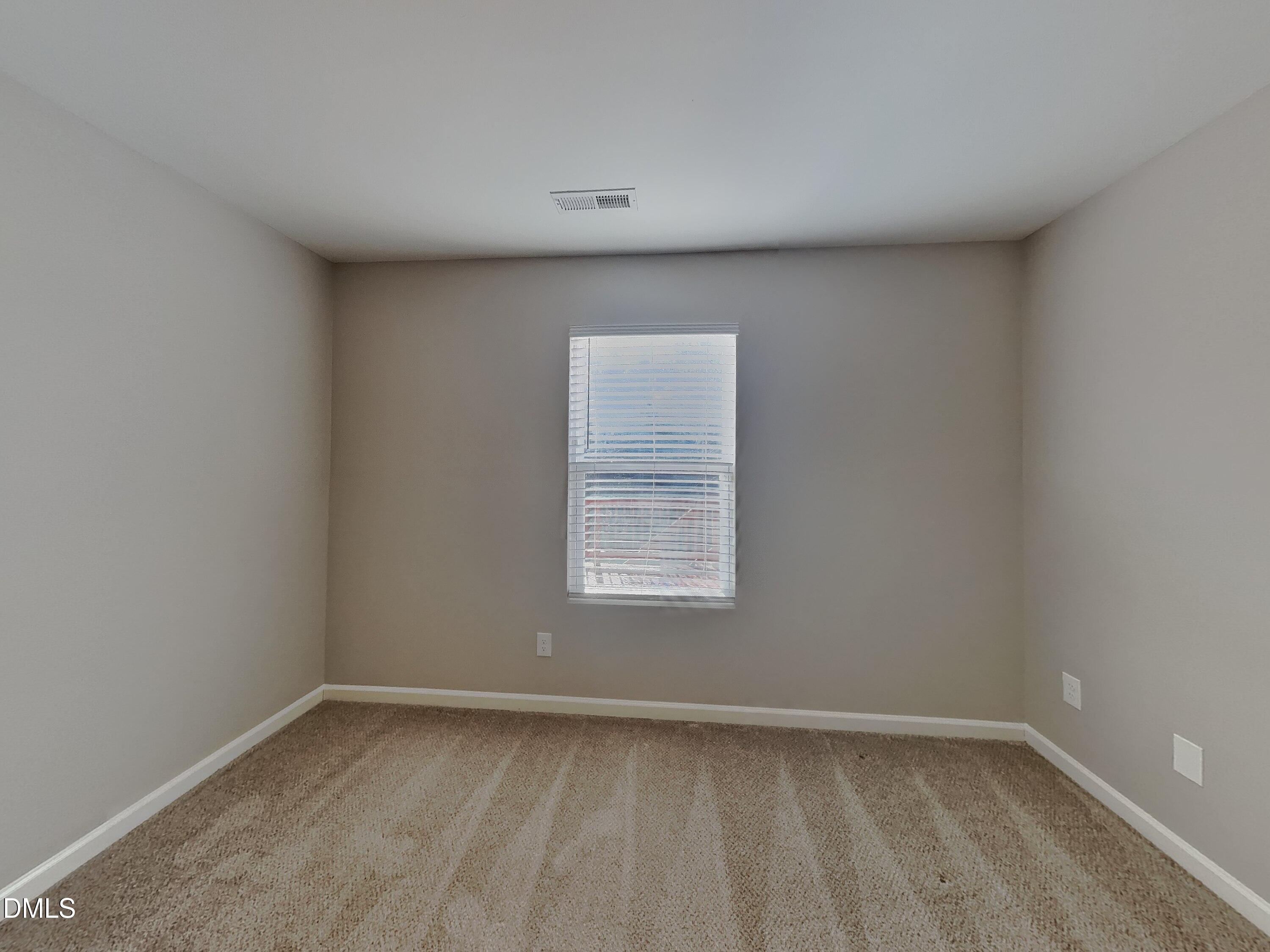 30 Gold Rush Court Clayton, NC 27527 - Photo 12 of 20 a view of an empty room with a window