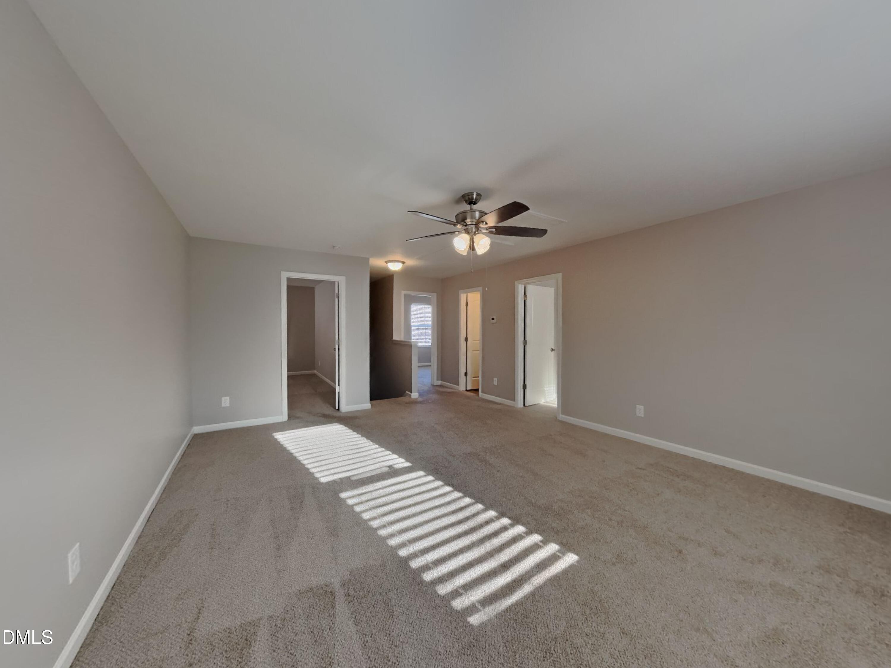 30 Gold Rush Court Clayton, NC 27527 - Photo 19 of 20 a view of an empty room with a chandelier fan