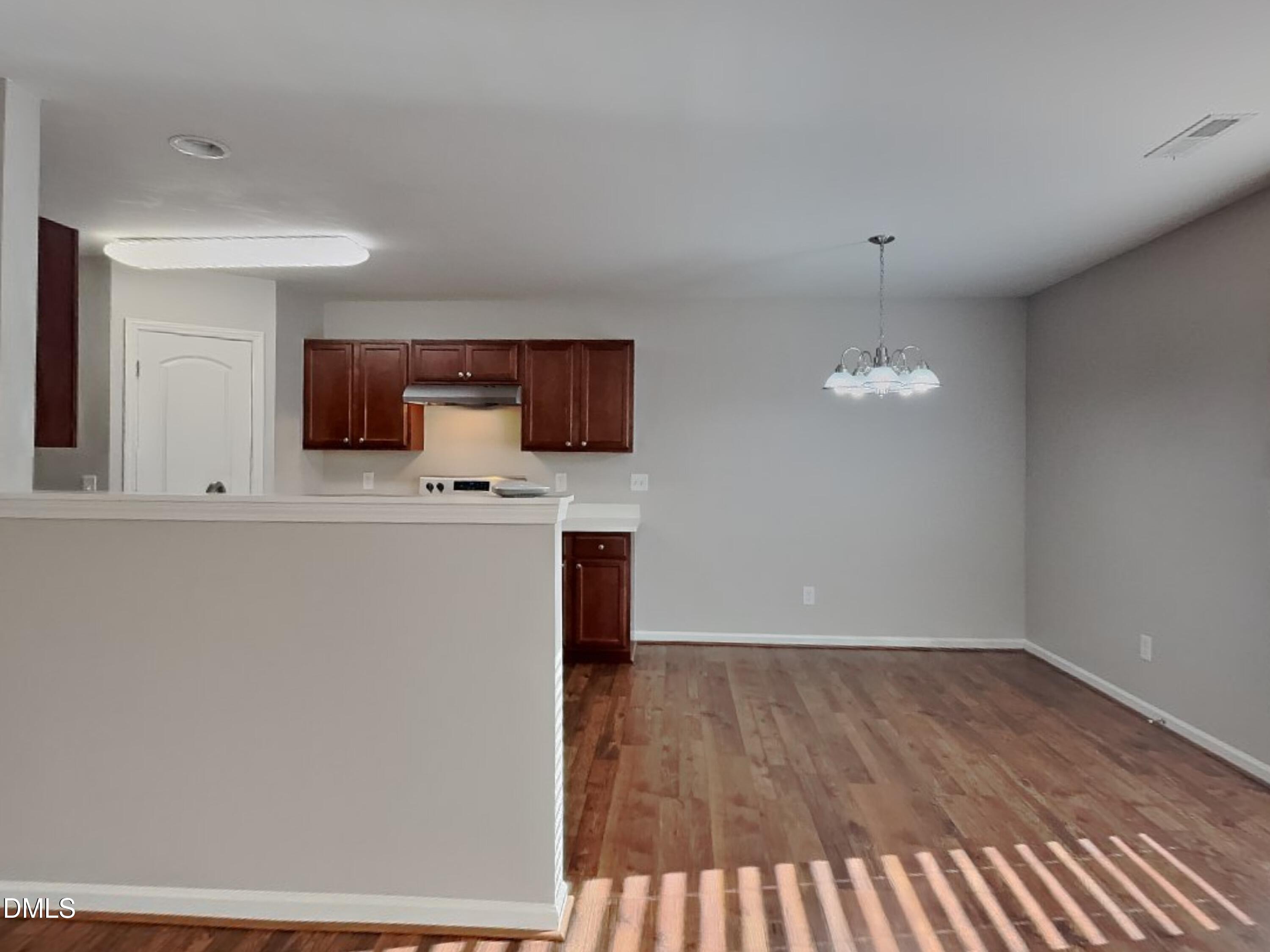 30 Gold Rush Court Clayton, NC 27527 - Photo 5 of 20 a view of a kitchen with a sink wooden floor and a window