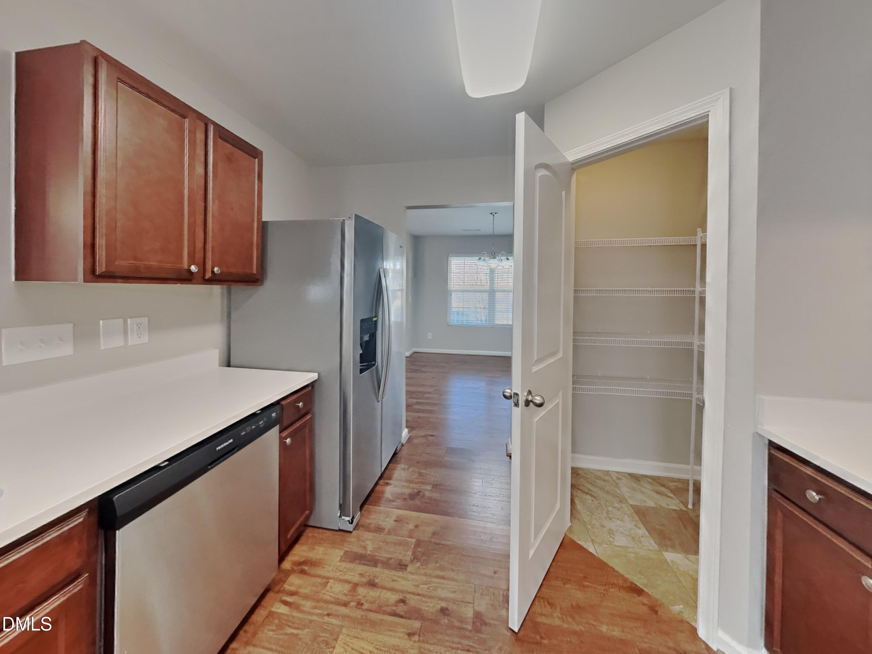 30 Gold Rush Court Clayton, NC 27527 - Photo 6 of 20 a kitchen with a refrigerator and a sink