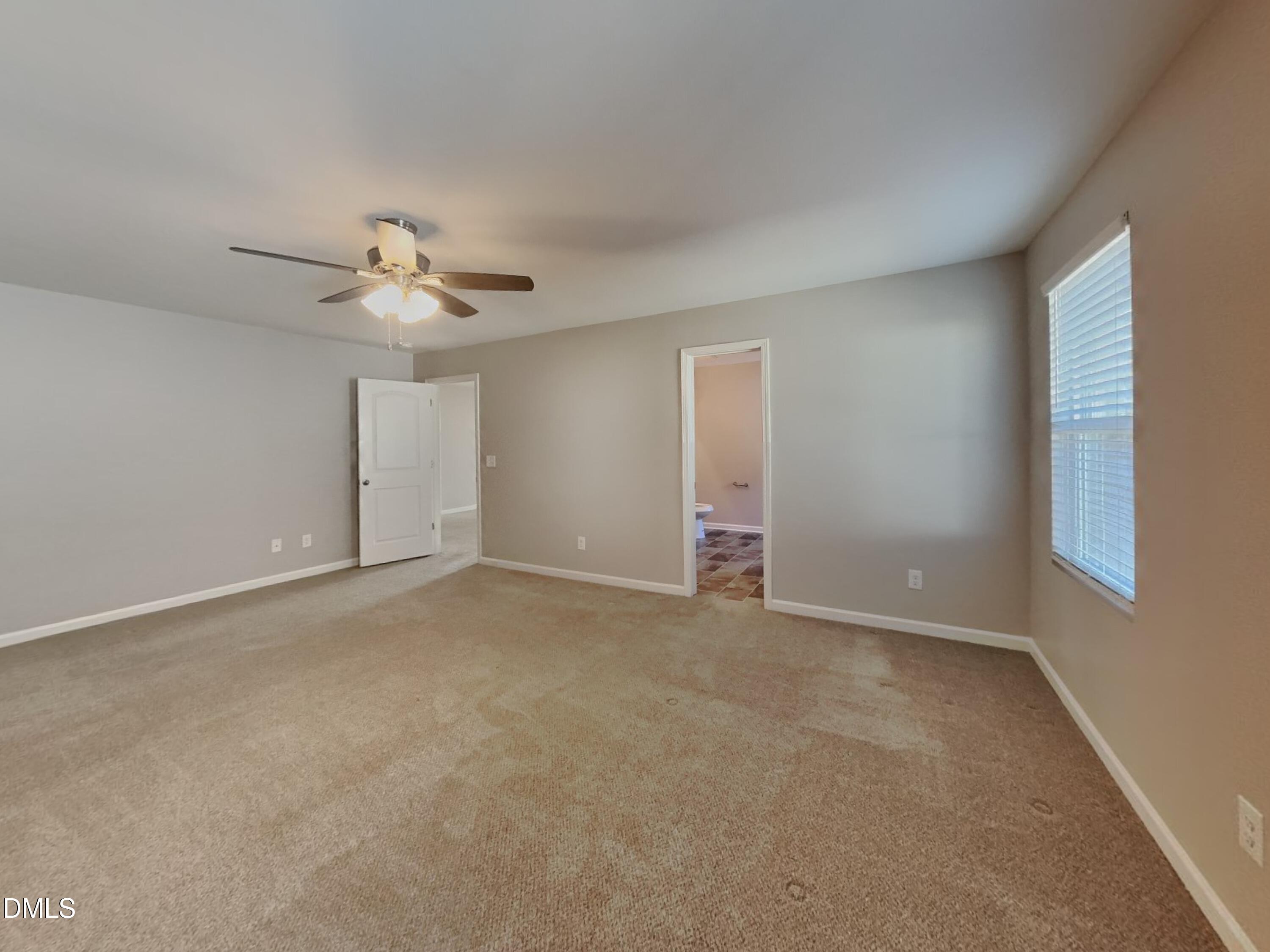 30 Gold Rush Court Clayton, NC 27527 - Photo 8 of 20 a view of an empty room with a chandelier fan