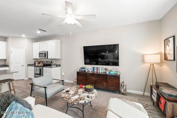 a living room with furniture and a flat screen tv