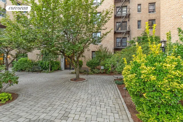 a view of a building with potted plants