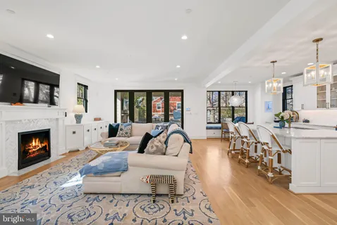a spacious bedroom with a bed and glass window