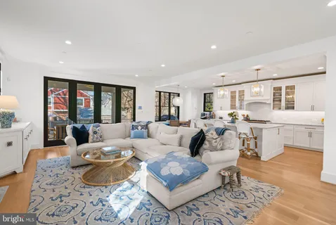 a bed sitting in a spacious bedroom next to a window