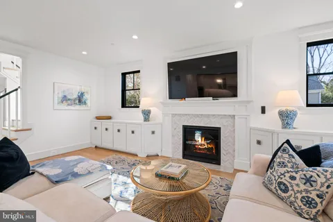 a bathroom with a bathtub toilet and window