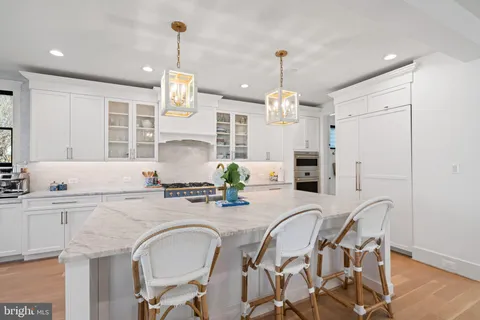 a bedroom with furniture and a chandelier