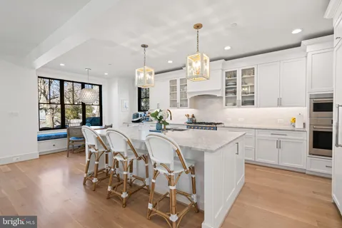 a bathroom with a sink a mirror a toilet and a shower