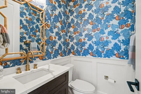 a room with lots of baby toys and flat screen tv