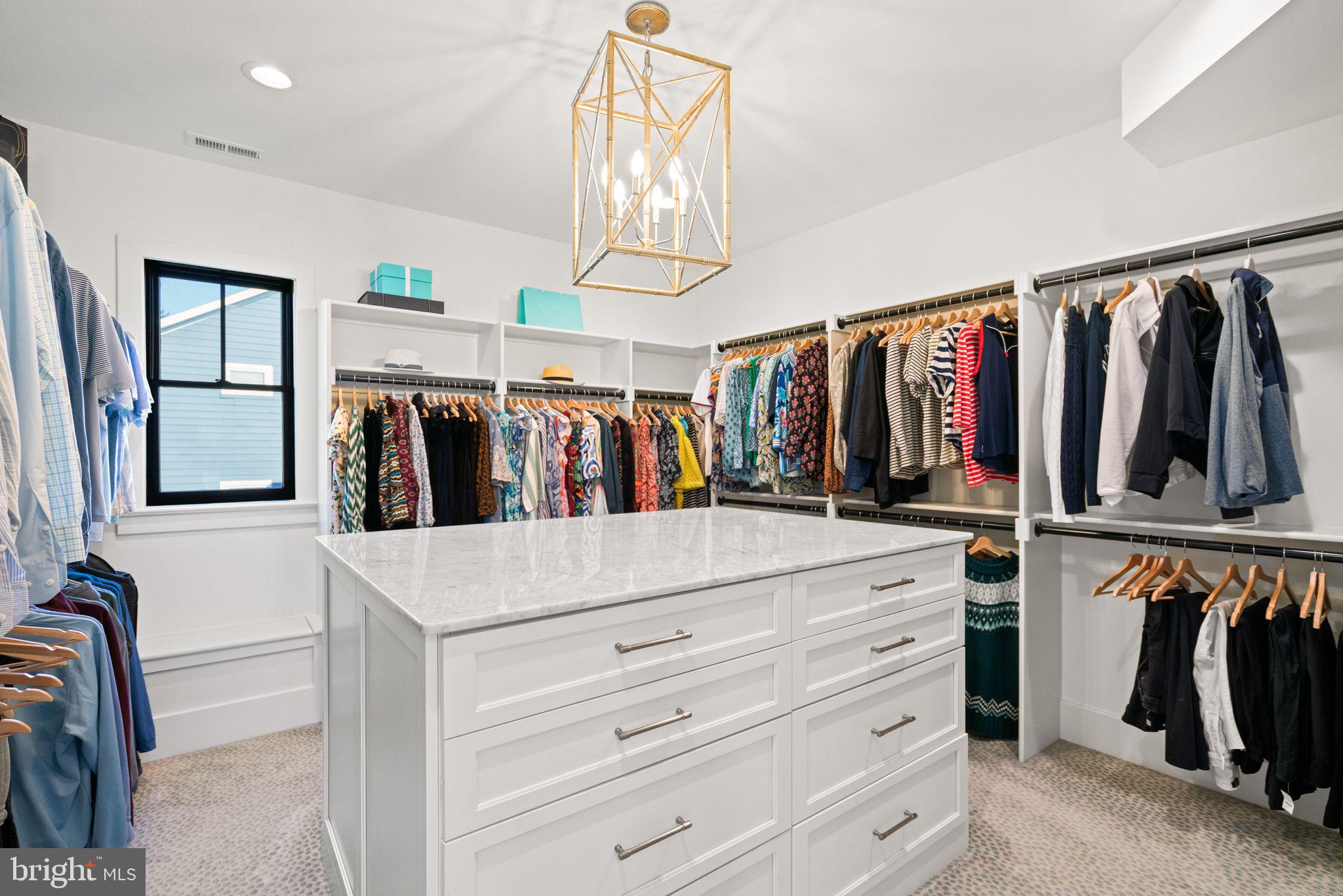4529 Rosedale Avenue Bethesda, MD 20814 - Photo 59 of 123 a view of walk in closet with clothes and shoes