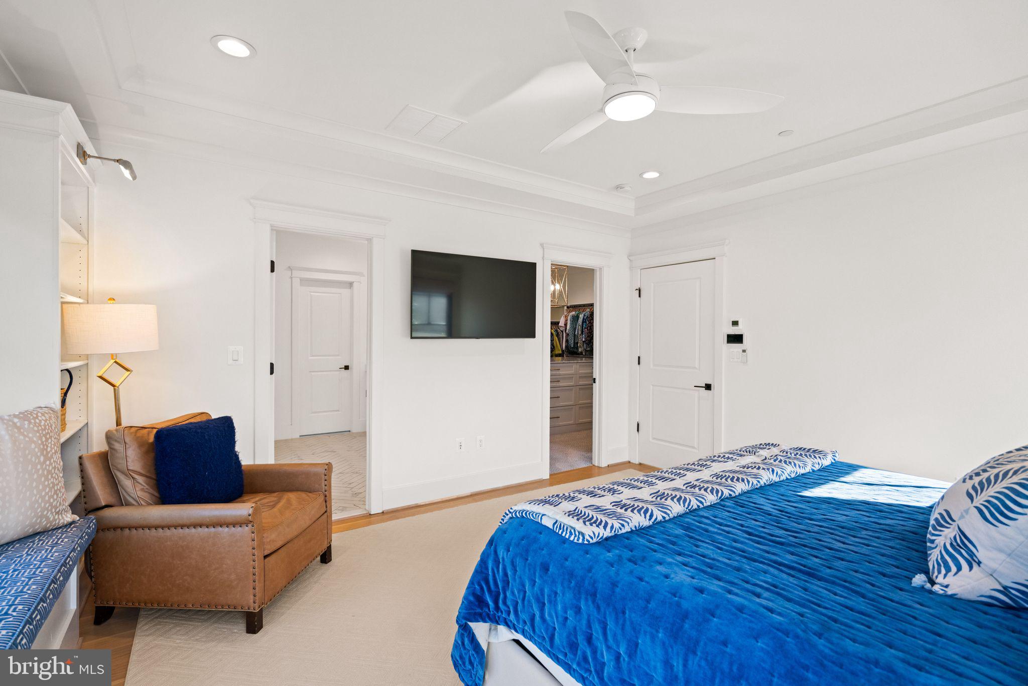 4529 Rosedale Avenue Bethesda, MD 20814 - Photo 63 of 123 a bedroom with a bed couch and a flat screen tv