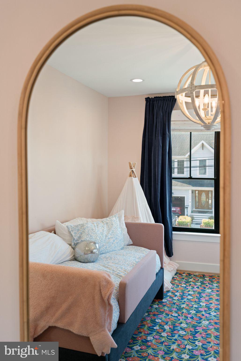 4529 Rosedale Avenue Bethesda, MD 20814 - Photo 75 of 123 a bedroom with a bed and a mirror