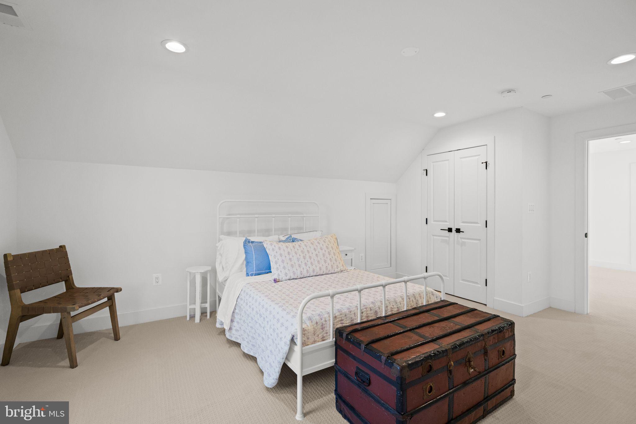 4529 Rosedale Avenue Bethesda, MD 20814 - Photo 95 of 123 a bedroom with a bed and a chair