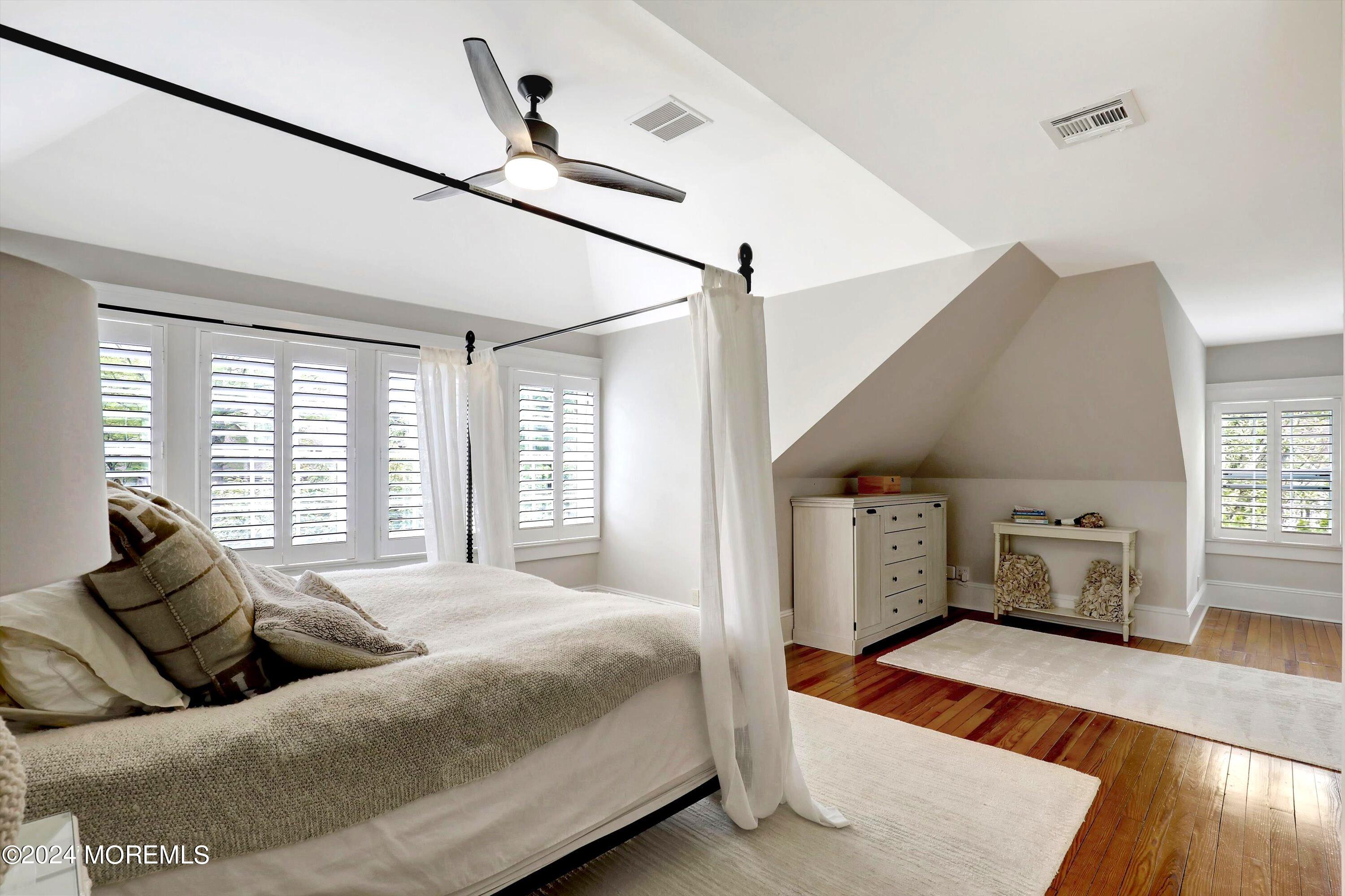 18 Hubbard Park Red Bank, NJ 07701 - Photo 23 of 54 a spacious bedroom with a bed and wooden floor