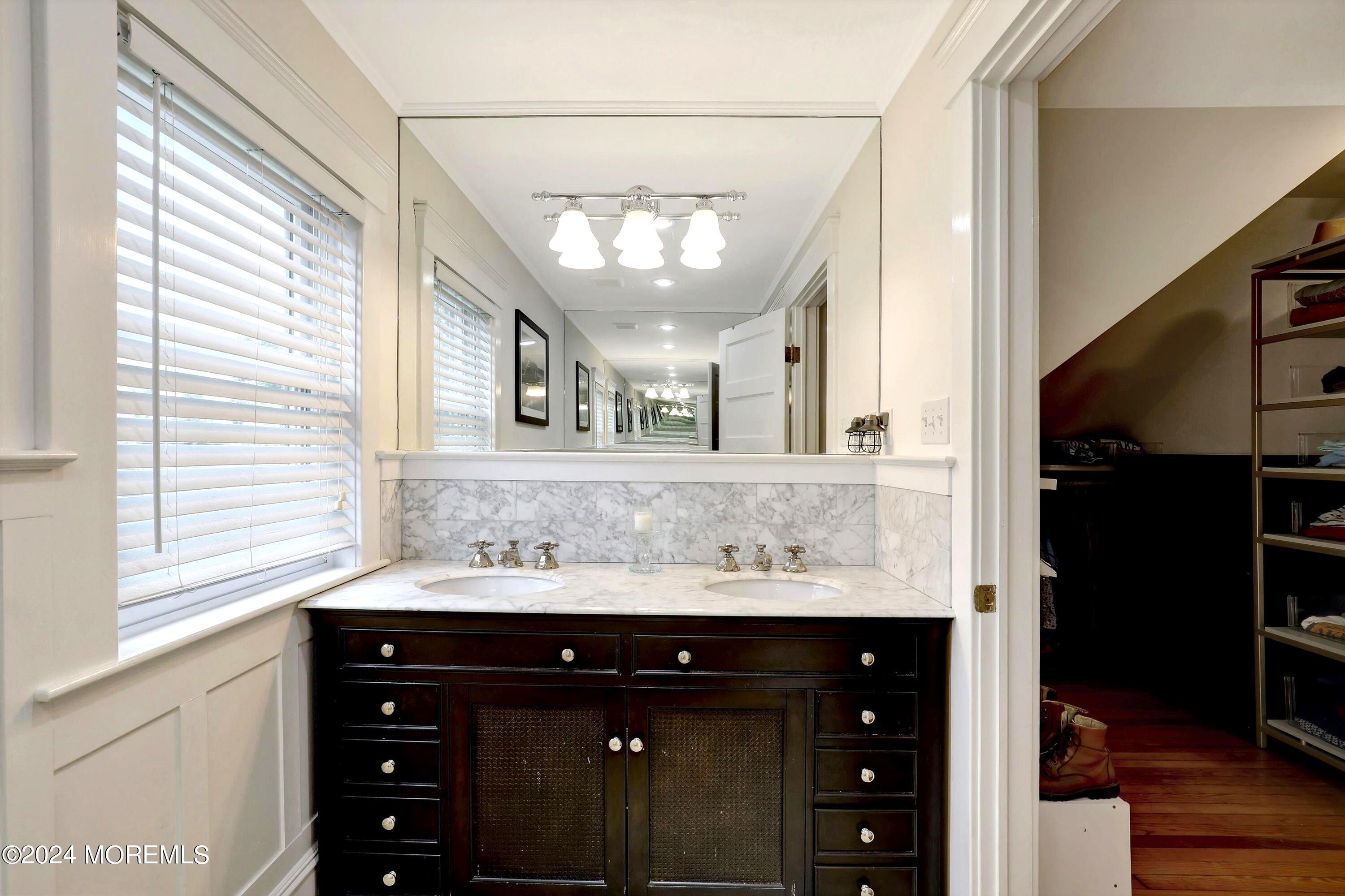 18 Hubbard Park Red Bank, NJ 07701 - Photo 26 of 54 a bathroom with a sink and a mirror