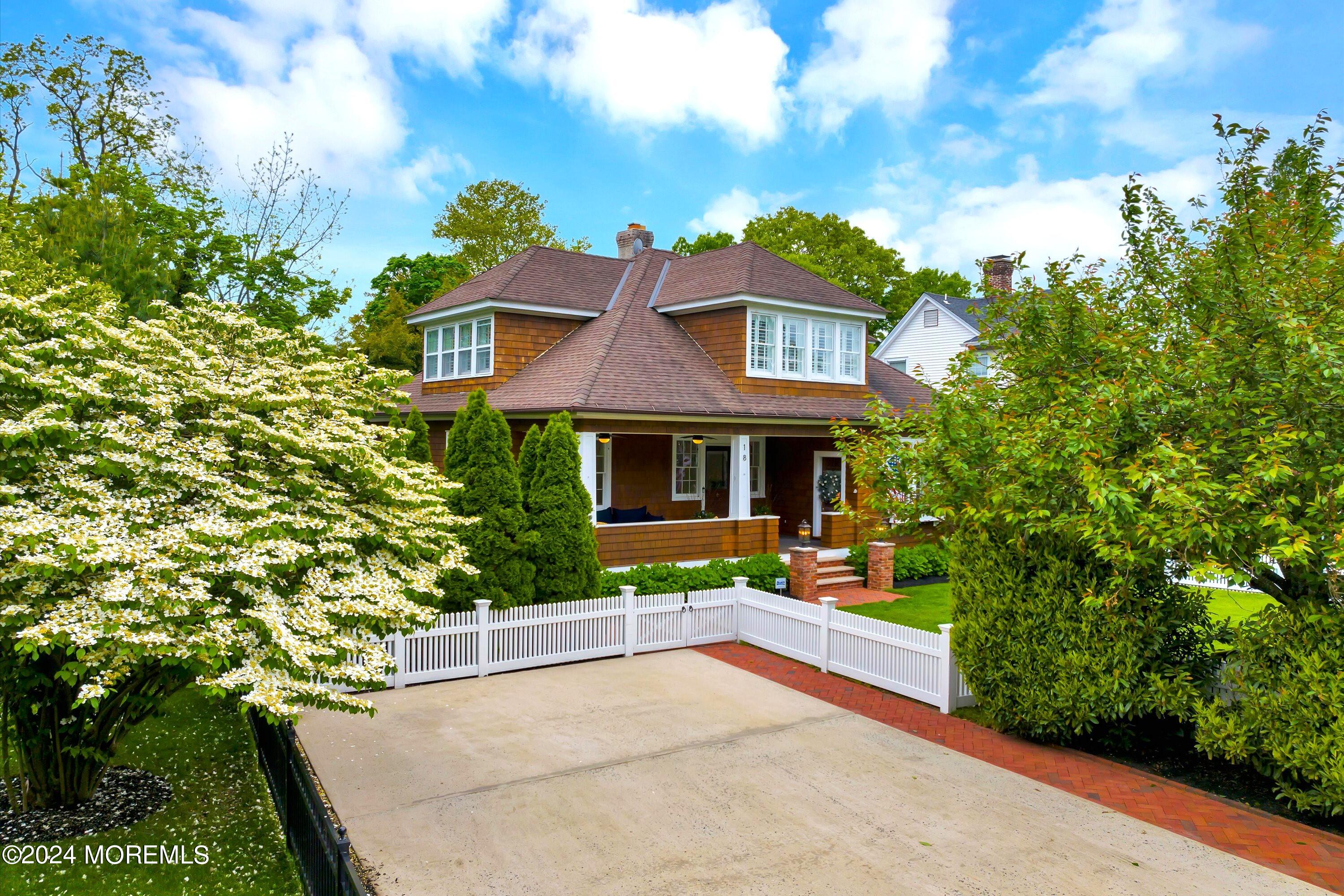 18 Hubbard Park Red Bank, NJ 07701 - Photo 54 of 54 a front view of a house with a yard and potted plants