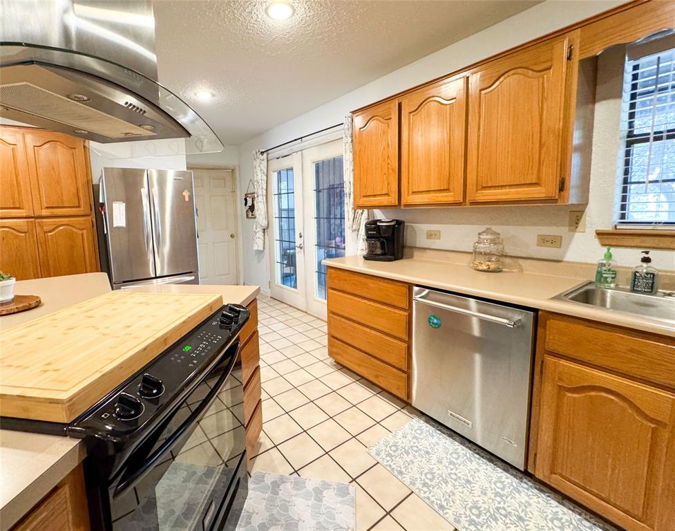 801 Highway 2214 Ranger, TX 76470 - Photo 15 of 40 a kitchen with a sink stove and cabinets